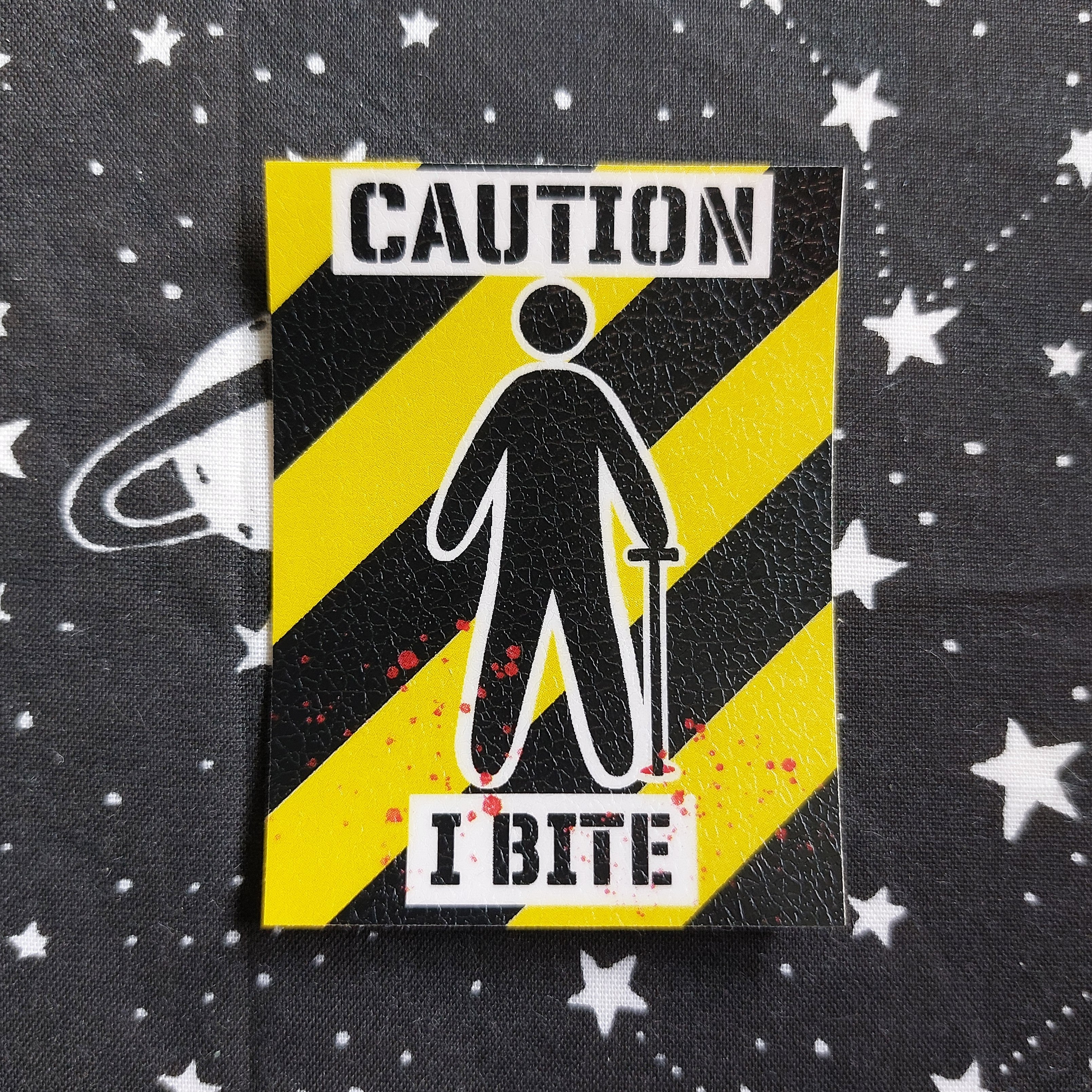 CAUTION I BITE sticker
